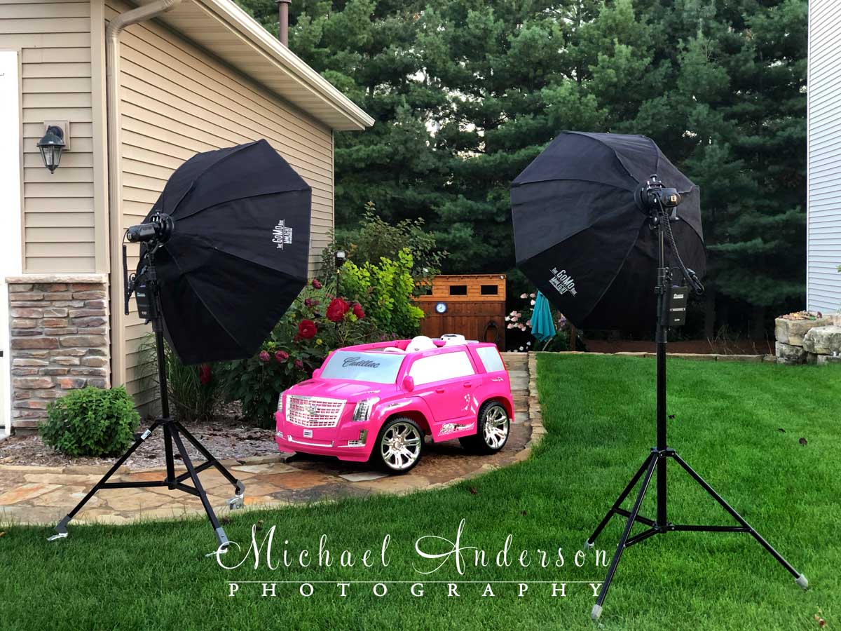 The set-up shot prior to light painting a pink Cadillac Escalade.