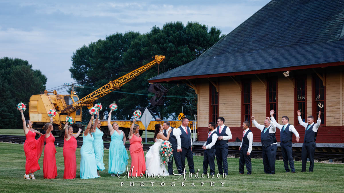 A fun wedding photo taken near the Federal Dam Depot at The Village in Hastings, MN.