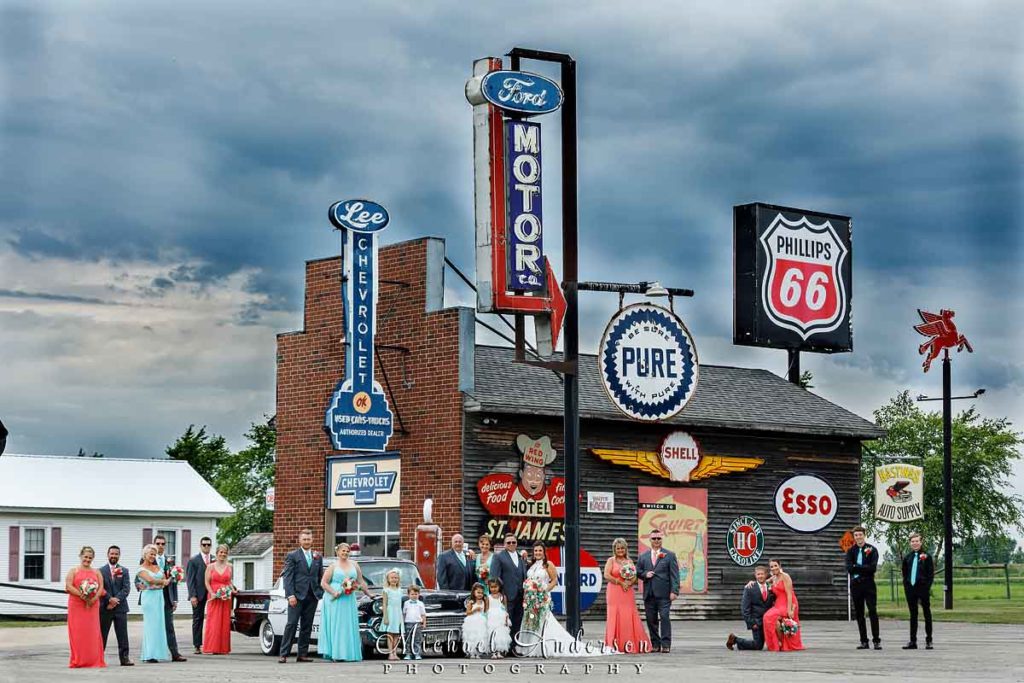 Wedding-party-photo-vintage-gas-station-at-Little-Log-House-Pioneer-Village
