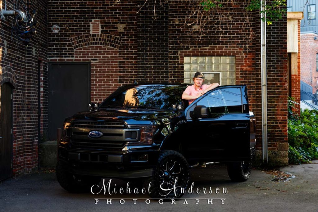 Cool senior photos in Stillwater, Minnesota of boy and his Ford F-150 pick up truck.