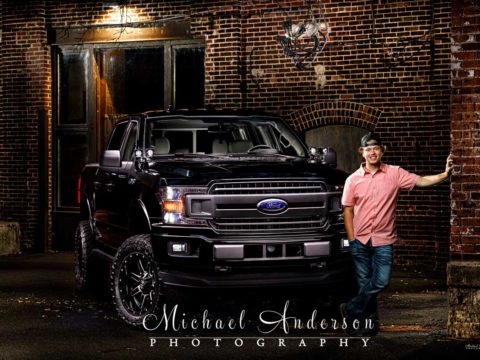 A cool senior portrait light painting with his Ford F-150 pickup truck.