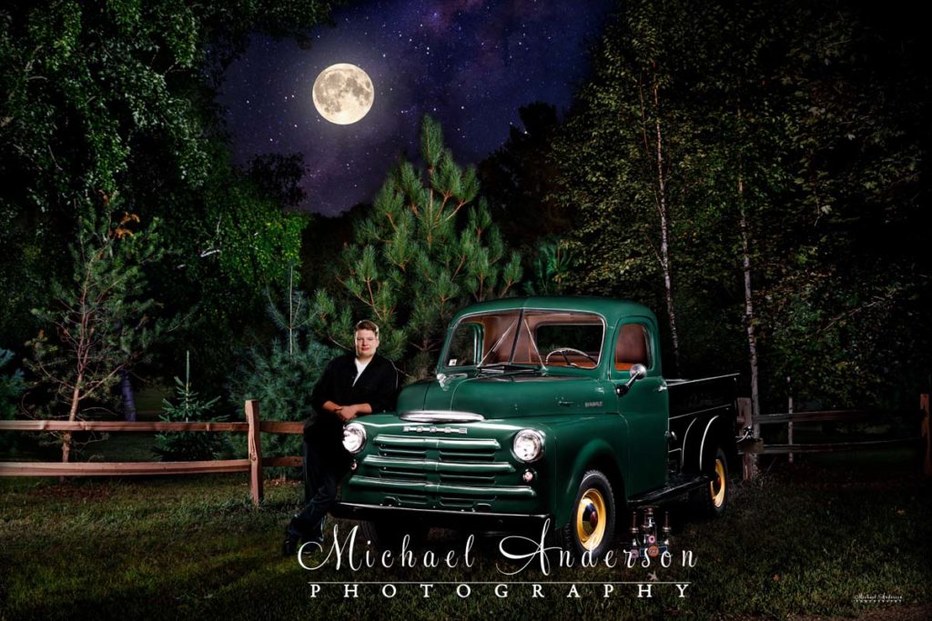 Cool-light-painted-senior-portrait-with-a-1950-Dodge-B2C-pick-up-truck-under-a-full-moon