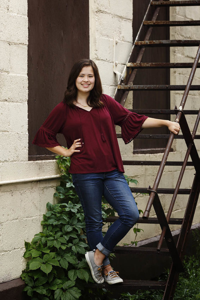 A cute senior picture taken on an old fire escape in Two Harbors, Minnesota.