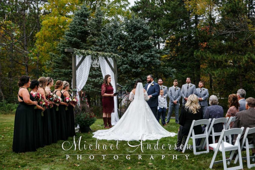 A photo of a pretty backyard wedding ceremony.