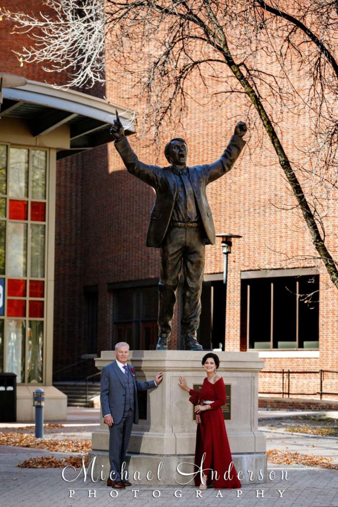 A candid wedding photo at Herb Brooks' statue near Rice Park in St. Paul, MN.