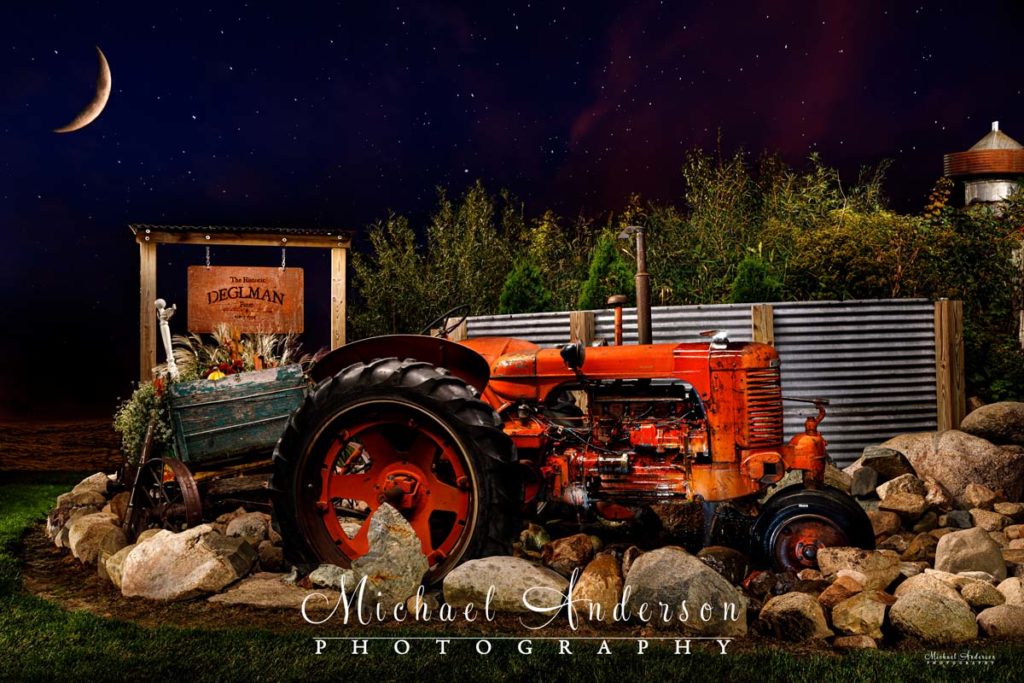 A cool light painted photo of a farm tractor, converted into a water fountain.