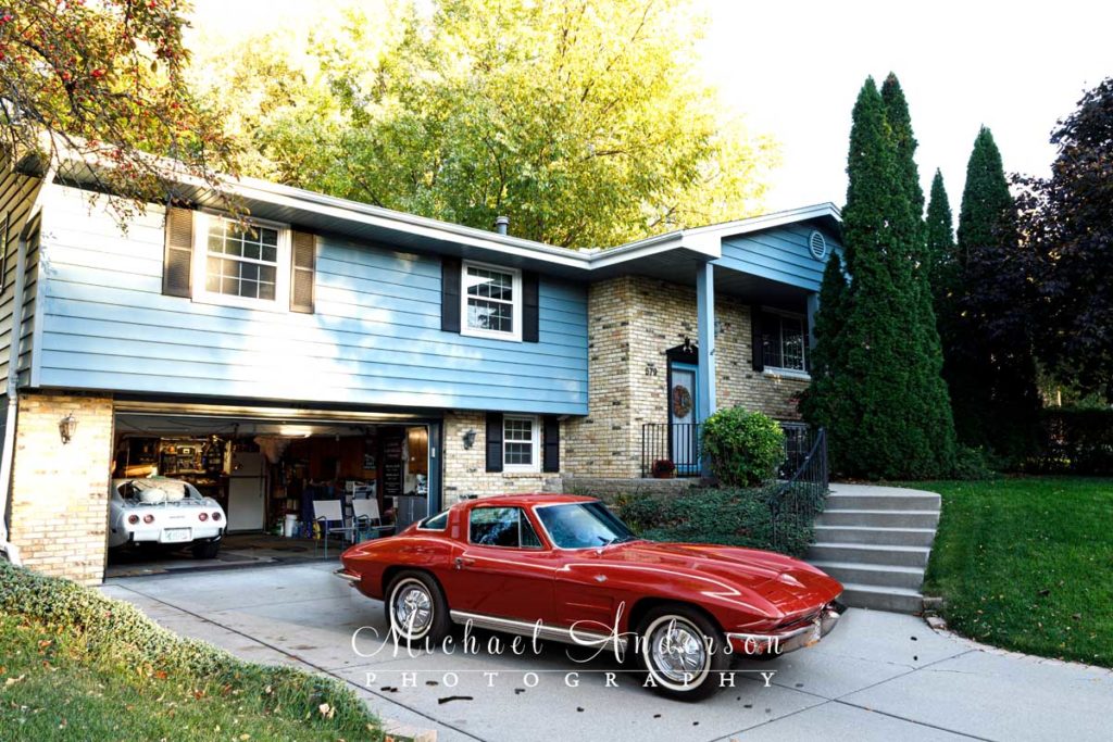 Photo of a 1964 Corvette in the owner's driveway.