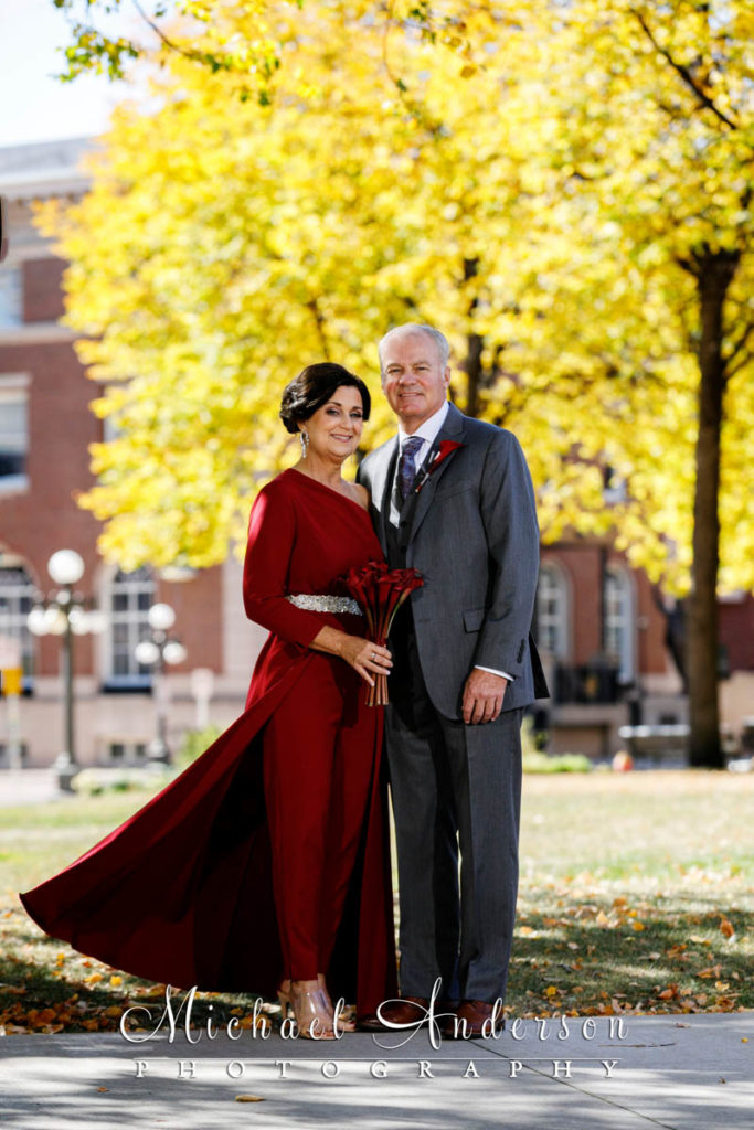 A stunning fall color wedding photograph of the bride and groom taken in Rice Park in downtown St. Paul, MN.