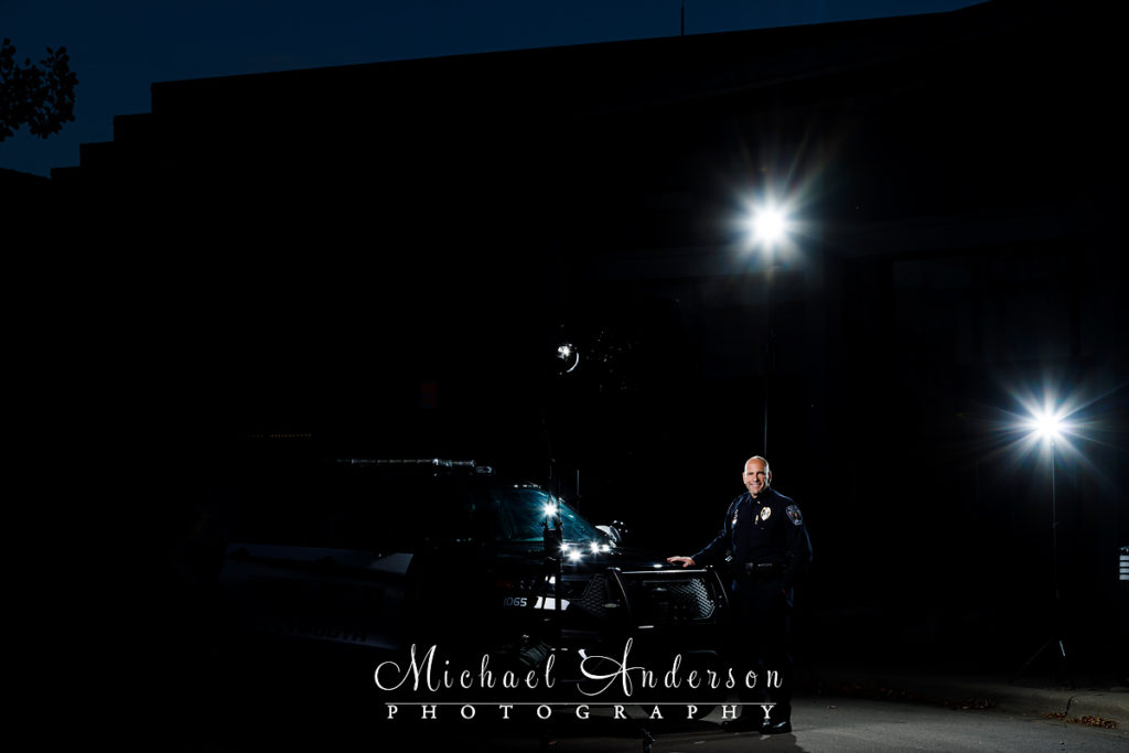 A portrait of Plymouth, MN Police Chief Mike Goldstein for a light painting with a squad car.