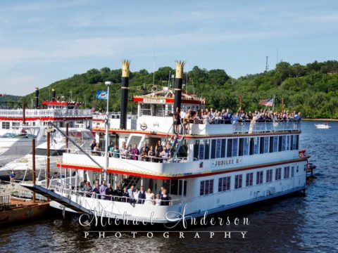 A fun wedding photo of all of the wedding guests aboard the Jubilee II on the St. Croix River in Stillwater, MN.