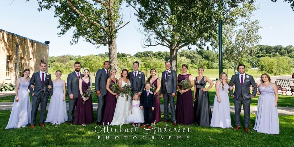 Photograph of the whole wedding party at Harriet Island in St. Paul, MN.