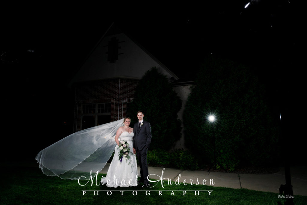 Photo of the bride and groom at Golden Valley Country Club before light painting the scene.