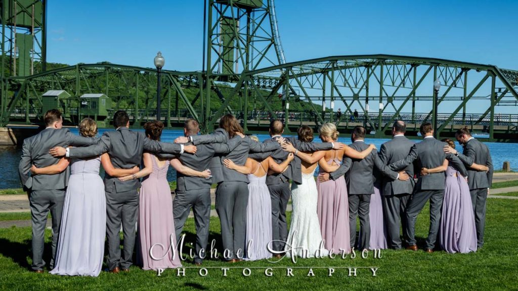 Wedding party photo looking towards Wisconsin at the Stillwater Lift Bridge.
