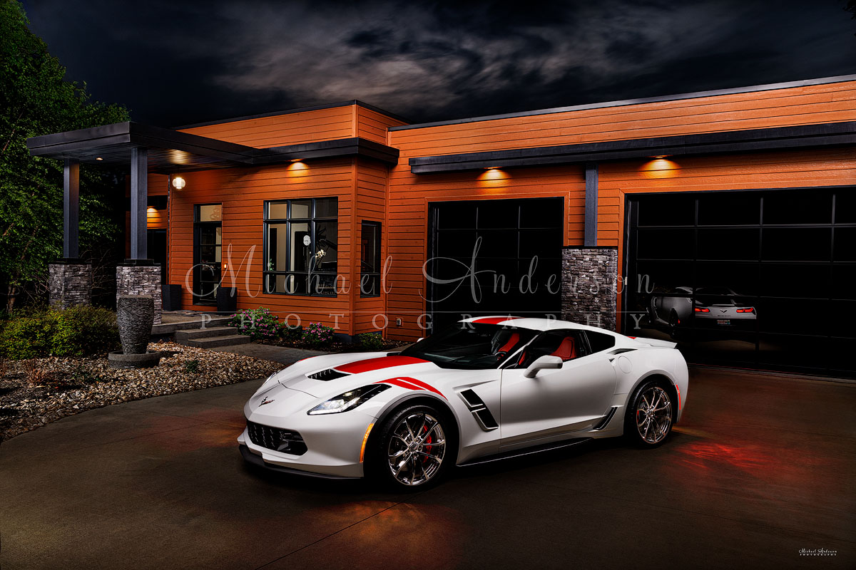 A stunning light painted photograph of a 2017 Corvette Grand Sport in front a beautiful contemporary home in the Ozarks.