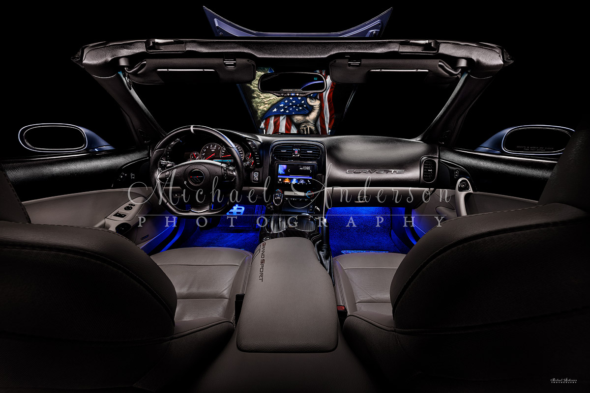 The beautiful interior of a 2013 Corvette Grand Sport light painted by Michael Anderson Photography.