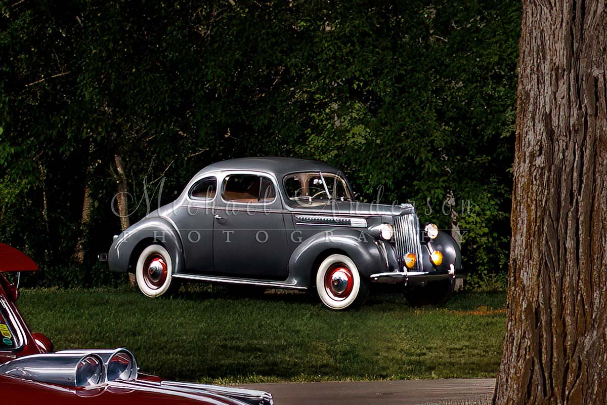 A light painted photograph of a 1939 Packard Coupe 110 Series. Part of a five-vehicle light painting project.