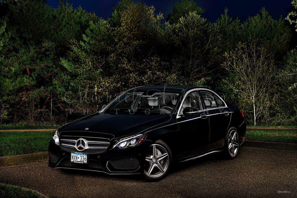 A cool light painted photo of a 2016 Mercedes Benz C300 in a park in Coon Rapids, MN.
