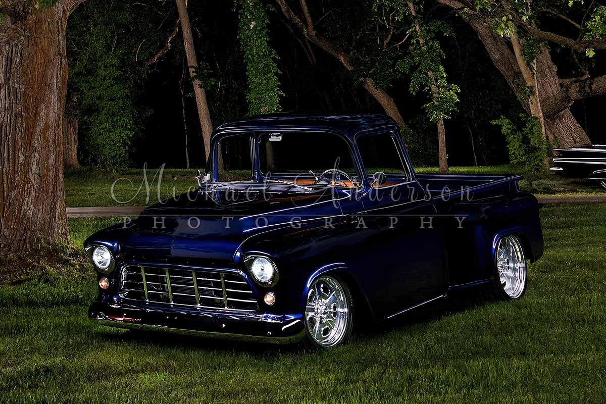 A cool light painted photograph of a 1955 Chevrolet 3100 Stepside Shortbox pickup truck. Part of a five-vehicle light painting project.