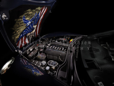A cool light painted photograph of the engine bay of a 2013 Corvette Grand Sport. The engine bay features a lot of Carbon Fiber Hydro-Dipped Engine Bay Components. This one-of-a-kind photograph was created on location by Michael Anderson Photography.