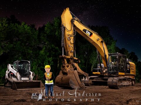 A cool light painting of a CATERPILLAR 329 EL and a Bobcat T590 along with a portrait of a little boy (who was safely added in post-production).