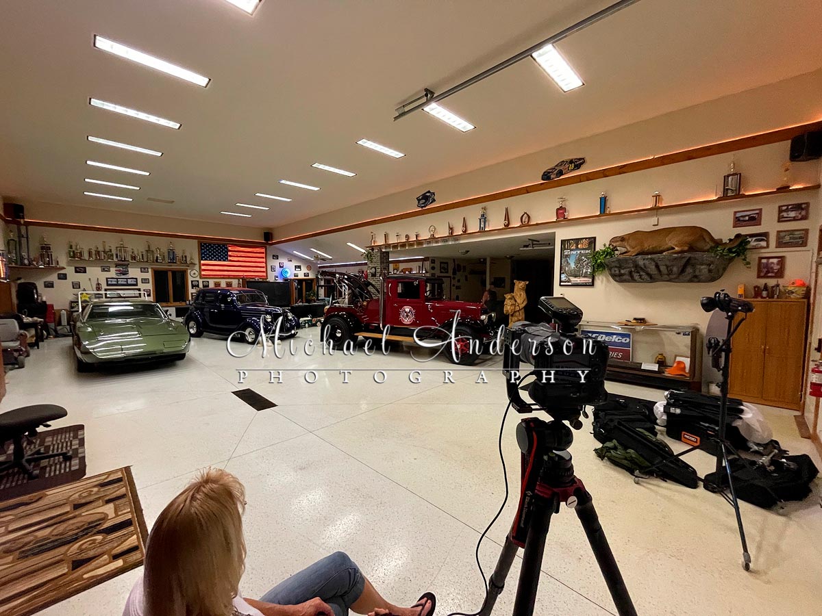 The set up photo, from the cameras perspective, before light painting the scene, of an International Wrecker and a 1936 Ford Sedan.