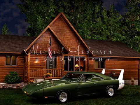 Light painted photo of a rare 1969 Dodge Daytona and a beautiful log home.