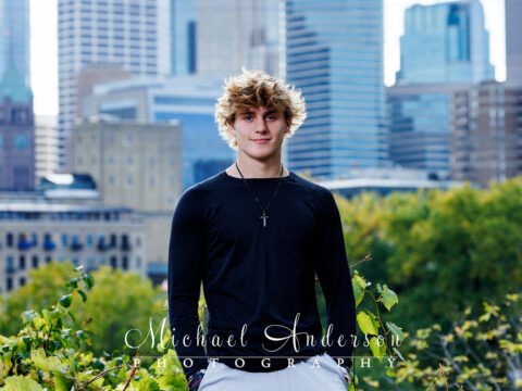 Senior photos at Saint Anthony Main in downtown Minneapolis. The Minneapolis skyline is also featured.