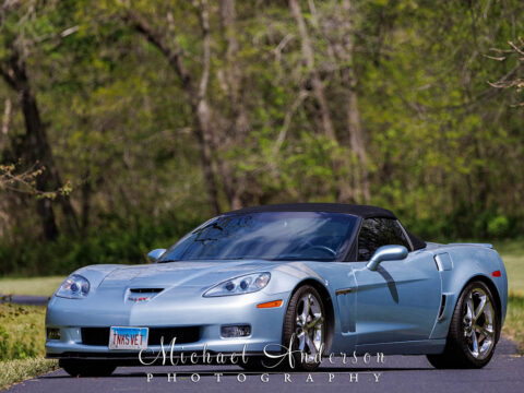 A stunning front view of a 2012 Carlisle Blue Corvette Grand Sport.