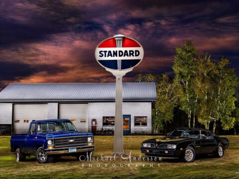 Light painted photograph of a 1979 Trans Am (with the front nose of a '78) and a 1979 Chevy C10 in front of an old service station.