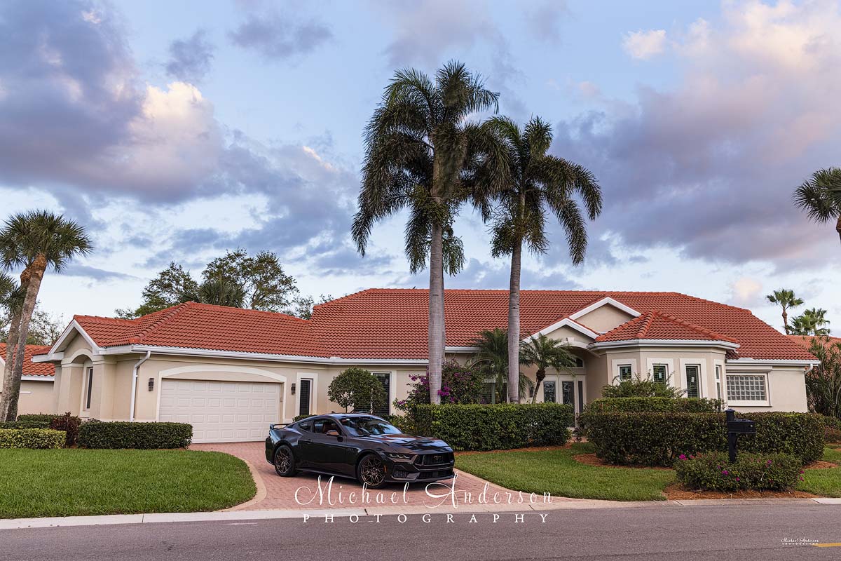 The pre-light painting photo of a 2024 Ford Mustang GT Performance in the driveway of a beautiful home in Fort Meyers, Florida.
