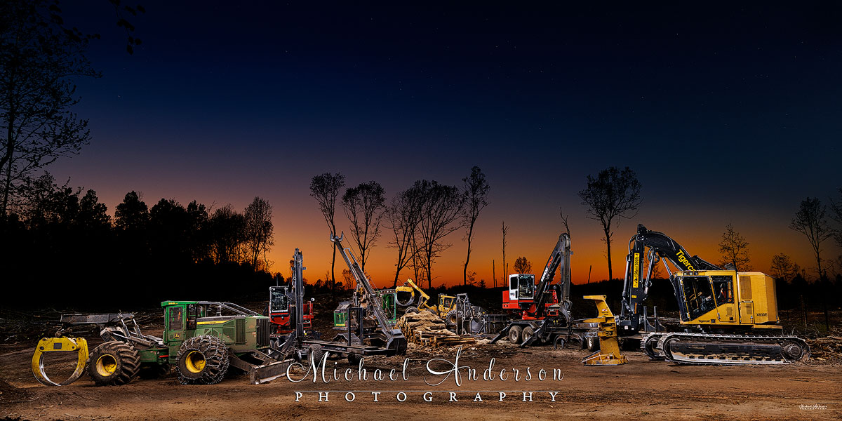 A cool light painted photograph of six pieces of forestry and logging equipment owned and operated by Fornengo Forest Products in Danbury, Wisconsin.