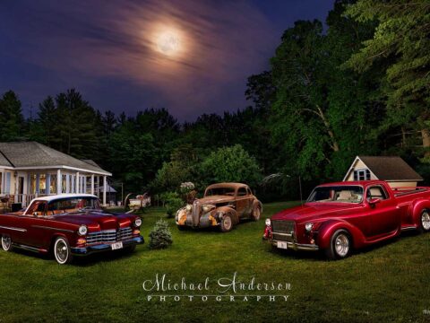 A pretty light painted photograph of a 3 one-of-a-kind vehicles. There's a 1955 Chevrolet Bel Air "El Camino" pickup truck, a 1939 LaSalle Rat Rod, and a 1978 Chevy Custom 3/4 ton pickup.