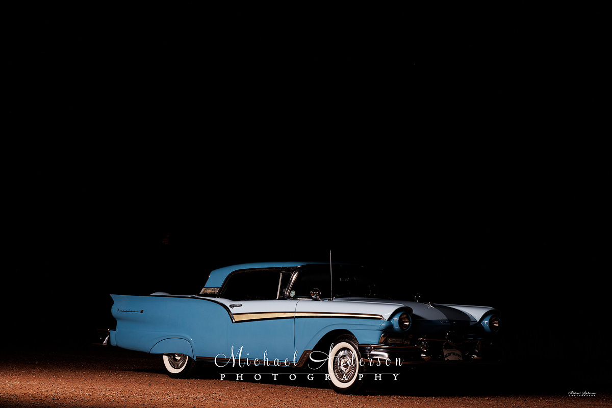 Photo of a 1957 Ford Fairlane 500 Skyliner, taken from the front 3/4 view. Photo was created prior to light painting the vehicle and the rest of the scene.