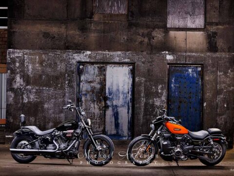 A stunning light painted photo of a 2025 Harley-Davidson Custom Street Bob and a 2024 Harley-Davidson Nightster Special.