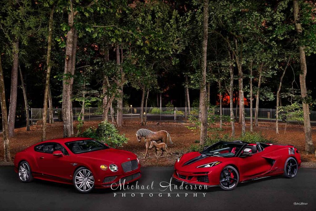 A beautiful light painted photograph of a red 2016 Bentley Continental GT Speed along with a red 2025 Corvette E-Ray with Callaway Supercharger.