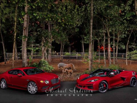 A beautiful light painted photograph of a red 2016 Bentley Continental GT Speed along with a red 2025 Corvette E-Ray with Callaway Supercharger.