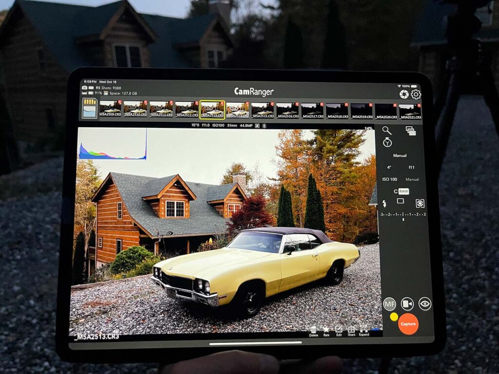 Behind-the-scenes photo of an iPad Pro's screen which shows the set up photo for the light painting of a 1972 Buick Skylark Convertible.