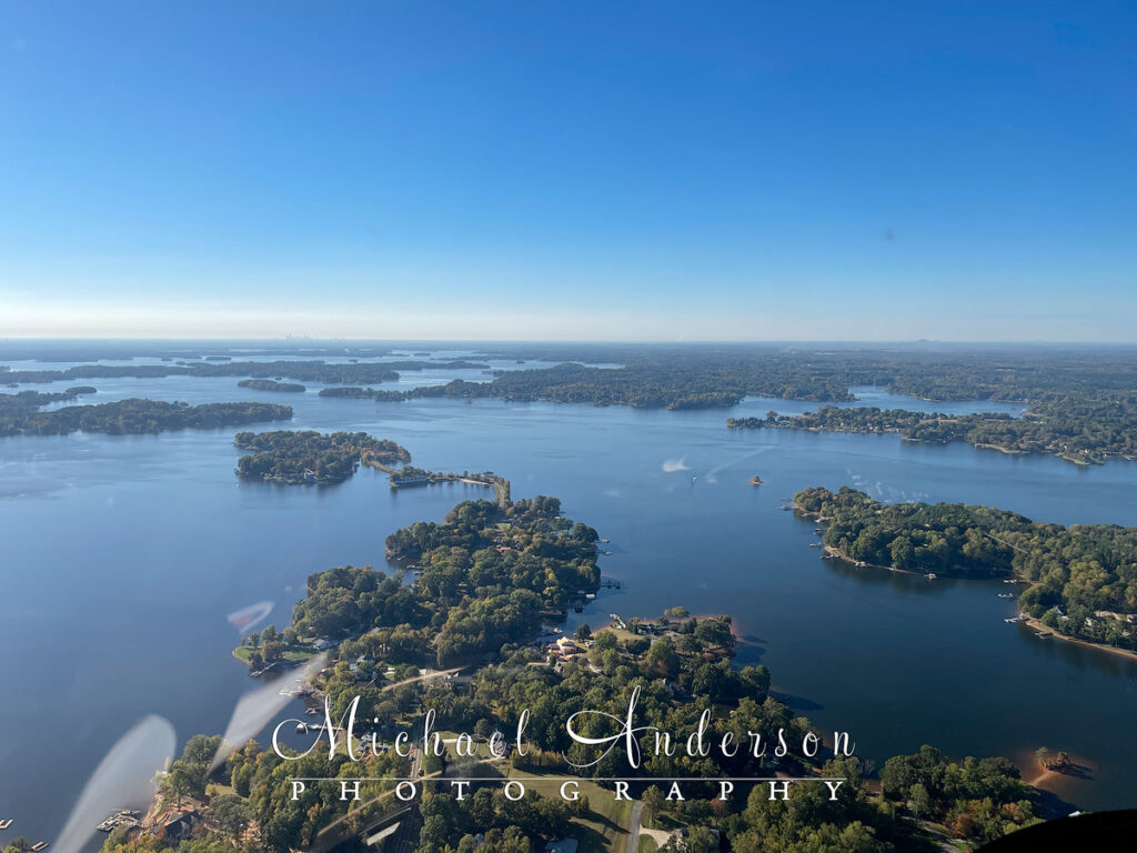 The view from the cockpit of a Bell 505 Helicopter over Lake Norman in North Carolina.