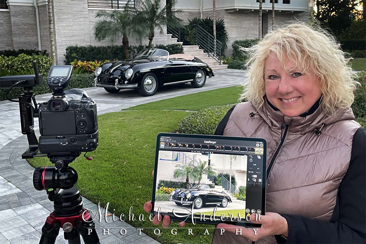The setup photo, displayed on an iPad Pro's screen, for the light painting of a black 1958 Porsche 356A 1600 Speedster.