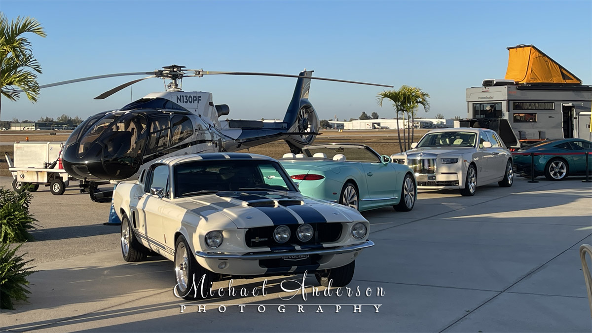 Some really cool cars, as well as a 2009 EUROCOPTER EC 130 B4 on display during the 2026 Jetport Reception for Cars on 5th in Naples, Florida.