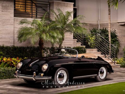 A beautiful light painted photograph of a mint condition black 1958 Porsche 356A 1600 Speedster.