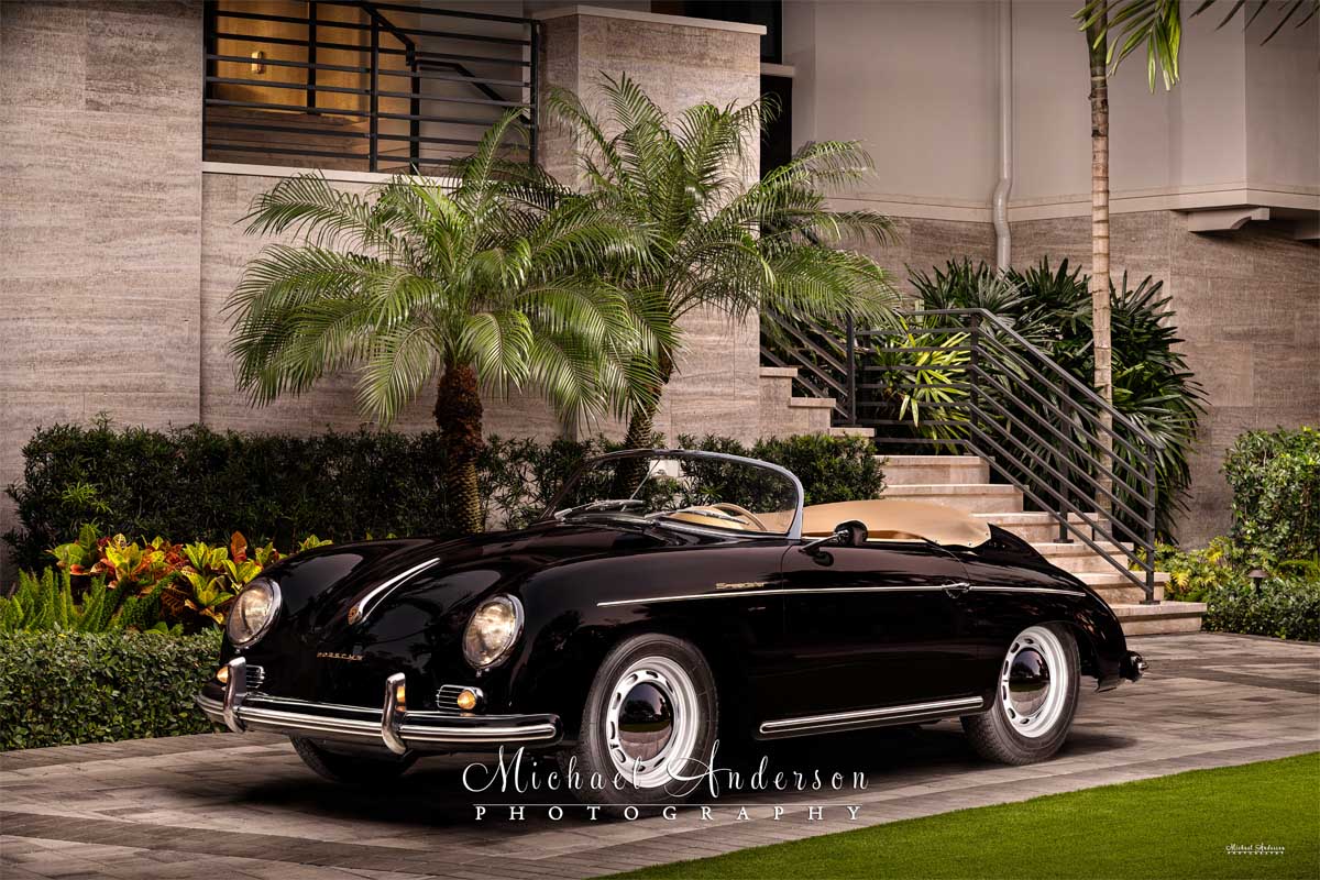 A beautiful light painted photograph of a mint condition black 1958 Porsche 356A 1600 Speedster.