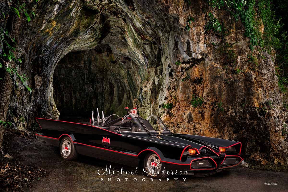 An amazing light-painted photograph of the Batmobile at the Batcave.