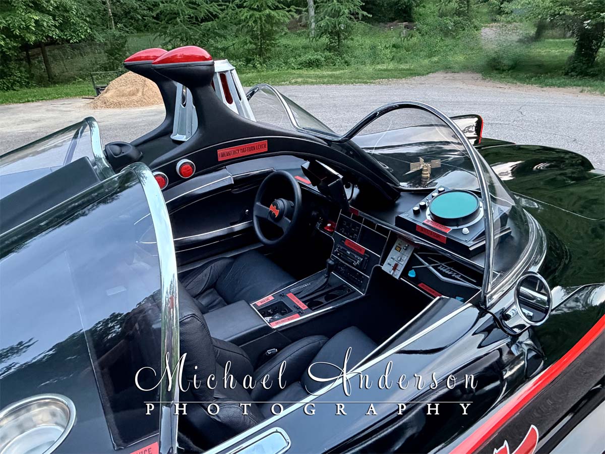Photo of the interior of the Batmobile, taken from the passenger side.