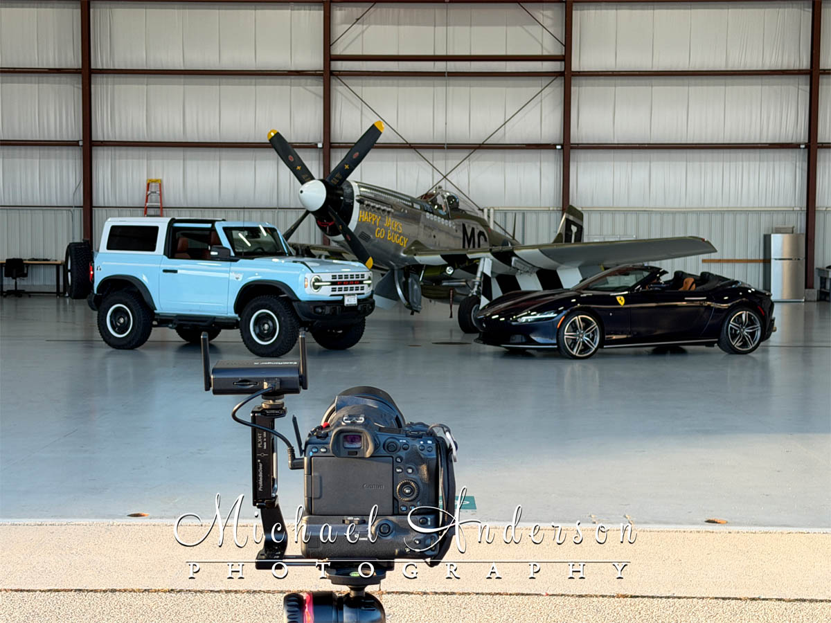 The camera setup photo to light paint three unique vehicles. From left to right we have a 2024 Ford Bronco Heritage Edition, the famous P-51 D Mustang “Happy Jack's Go Buggy”, and a 2025 Ferrari Roma Spider!