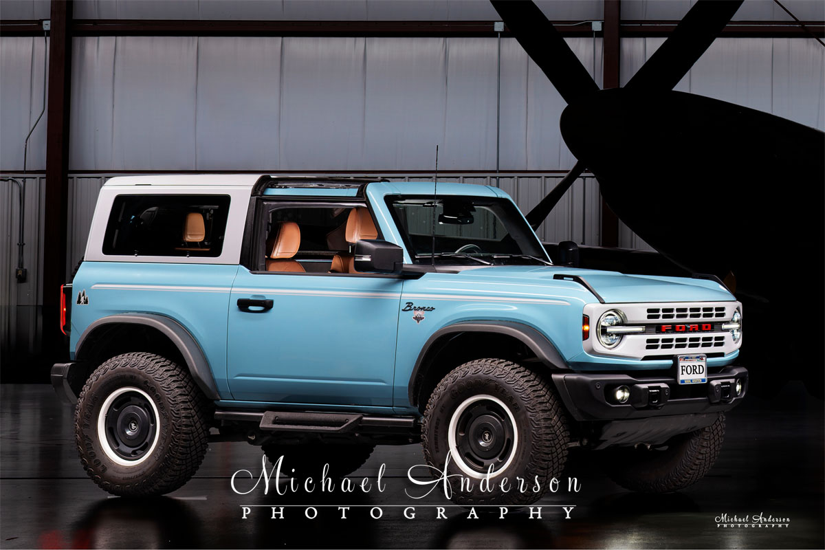 A cool light painted photograph of a Robin's Egg Blue 2024 Ford Bronco Heritage Edition. This image was created as part of a 3-vehicle light painting at the airport in Oshkosh, WI.