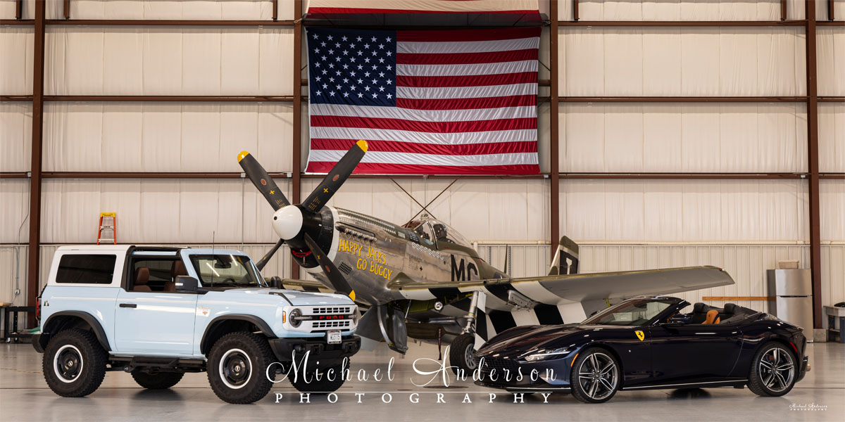 The base image for the light painting of three unique vehicles. From left to right we have a 2024 Ford Bronco Heritage Edition, the famous P-51 D Mustang “Happy Jack's Go Buggy”, and a 2025 Ferrari Roma Spider!