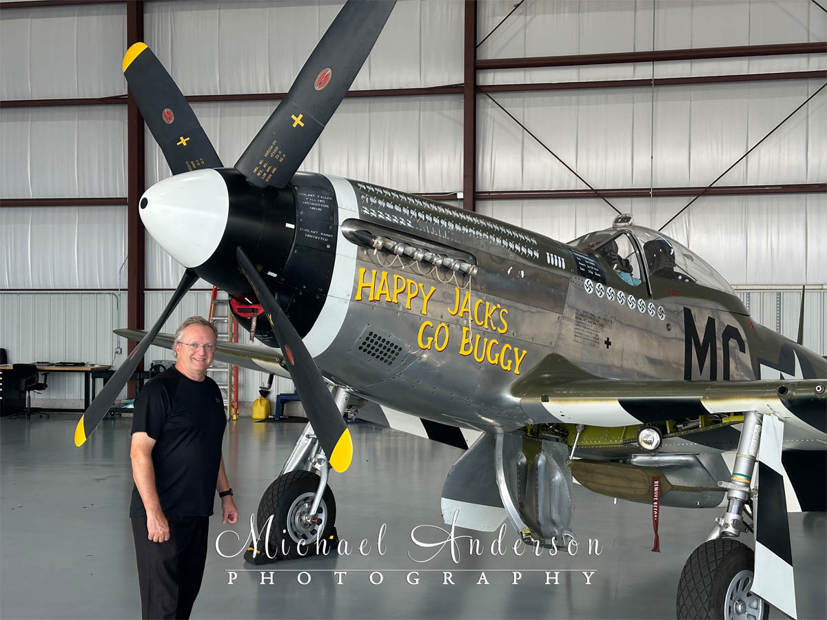 Professional photographer, Michael Anderson posing with the amazing P-51D Mustang, "Happy Jack's Go Buggy"!