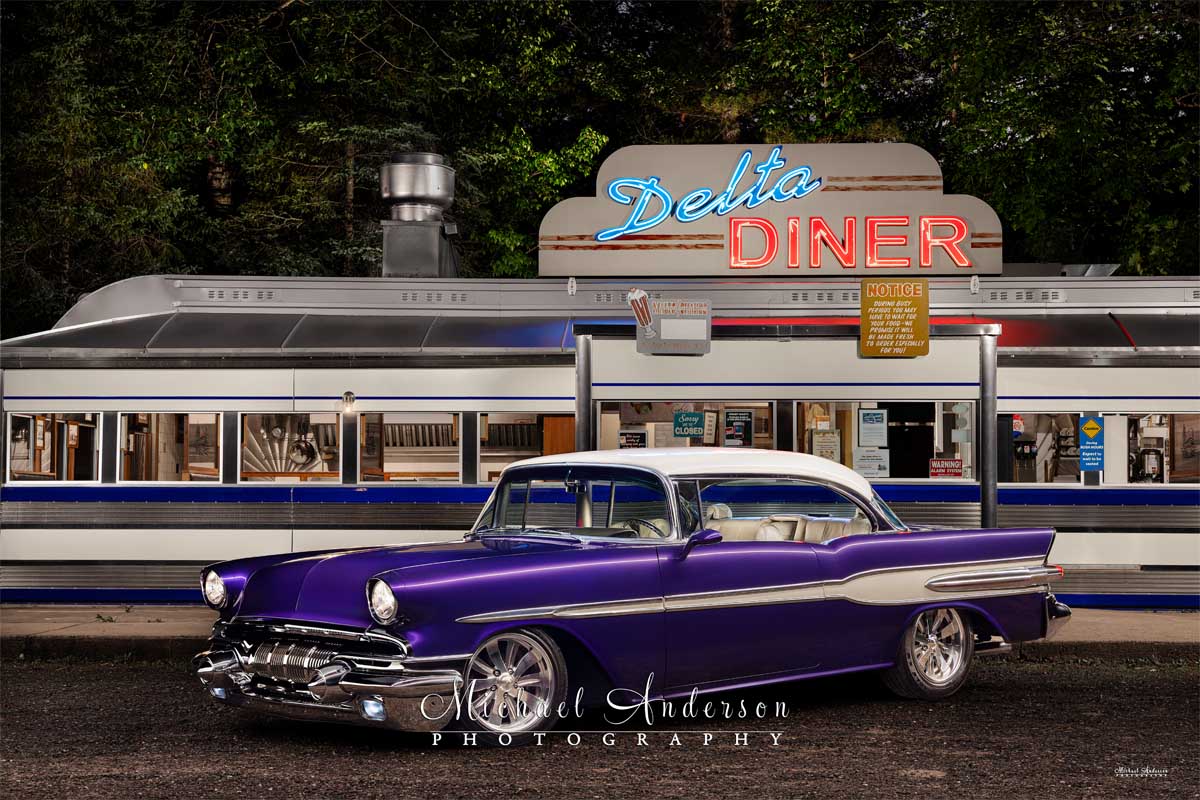 A wonderful light-painted photograph of a 1957 Pontiac Chieftain in front of the Delta Diner in Mason, Wisconsin.