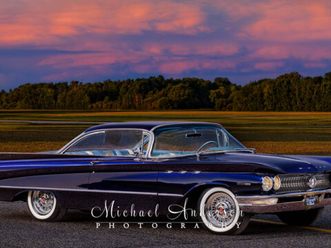 A beautiful light-painted photograph of a Midnight Blue 1960 Buick Invicta Custom.
